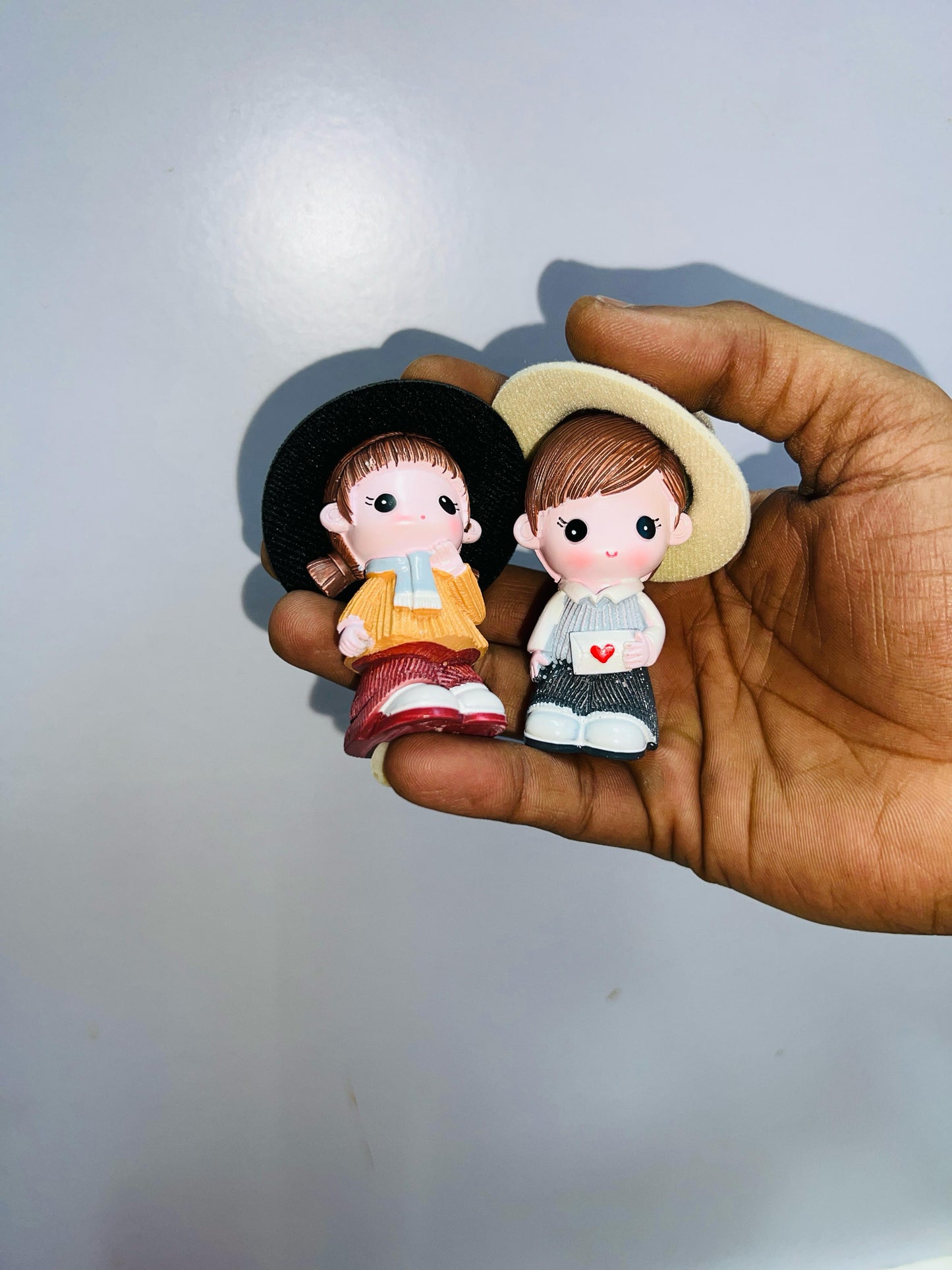 Hat with dolls